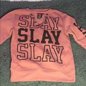 rose colored v-neck sweat shirt
